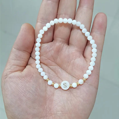 Pulseira Tecido com Inicial Pérola