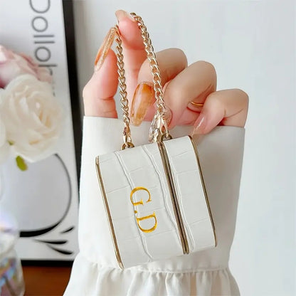 Capa AirPods Croc com detalhe dourado